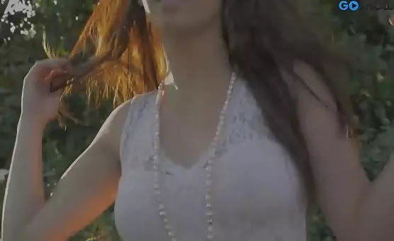 Happy Girl Outdoors Teases in White Dress